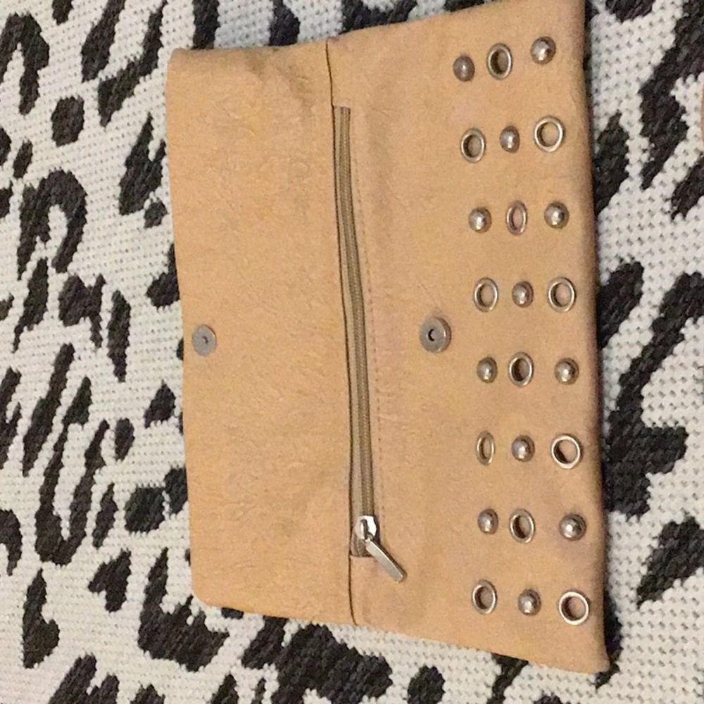 It is a tan purse